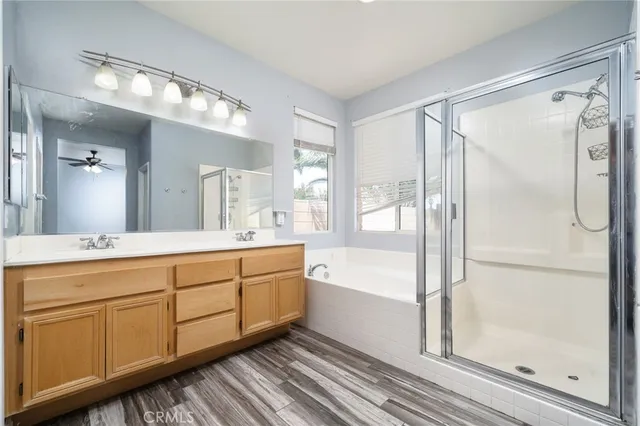 a spacious bathroom with a tub shower and sink