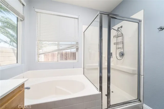 a bathroom with a bathtub and a shower