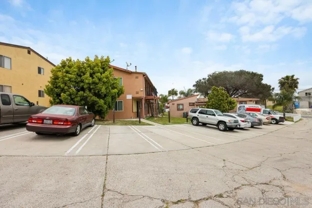 a view of street with parked cars