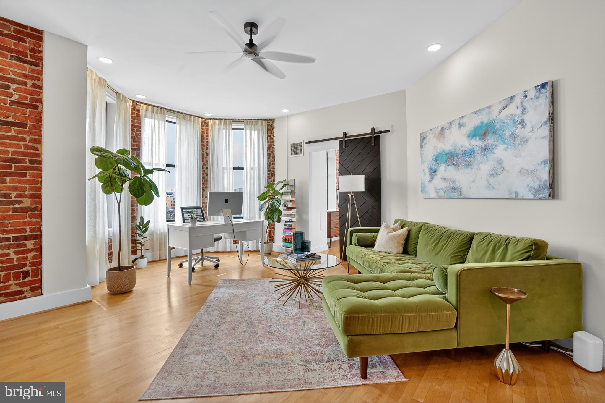 1615 Q Street Northwest, Unit 601 Washington, DC 20009 - Photo 5 of 19 a living room with furniture and wooden floor
