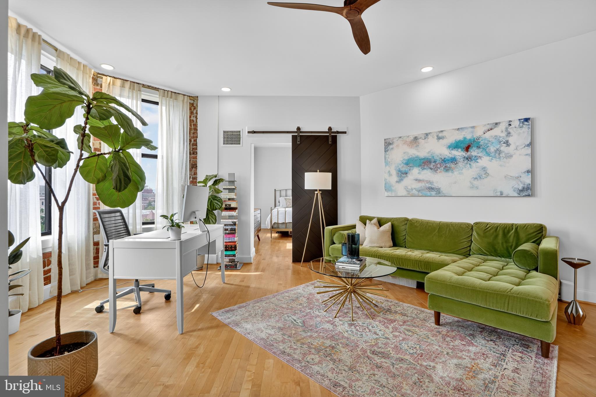 1615 Q Street Northwest, Unit 601 Washington, DC 20009 - Photo 10 of 19 a living room with furniture and a large window