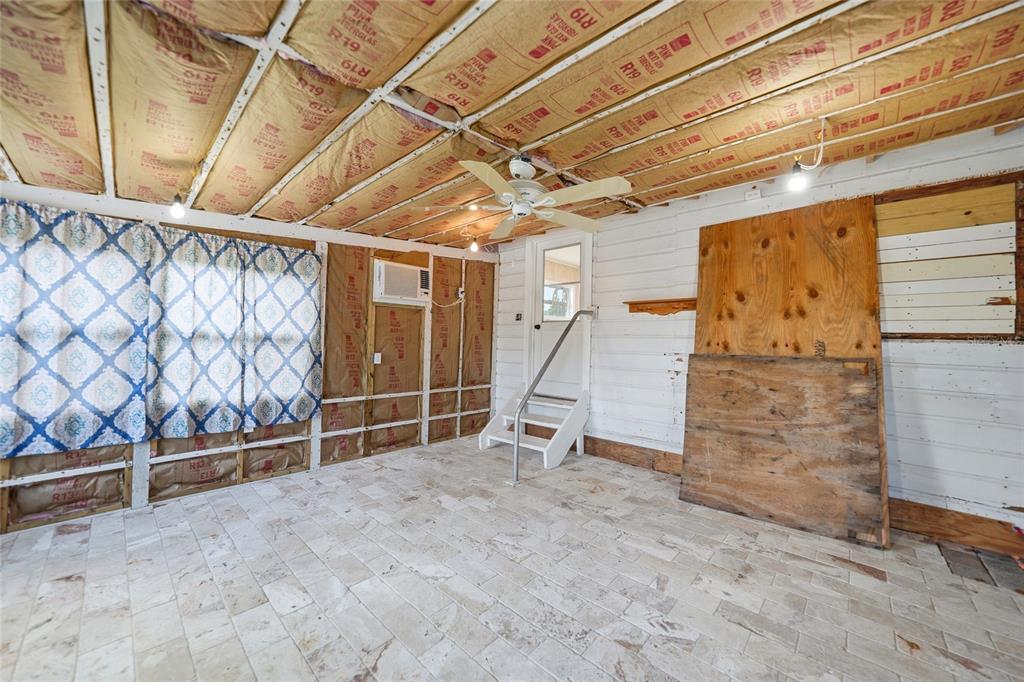 8164 Archie Street Englewood, FL 34224 - Photo 24 of 42 a view of an empty room with wooden walls