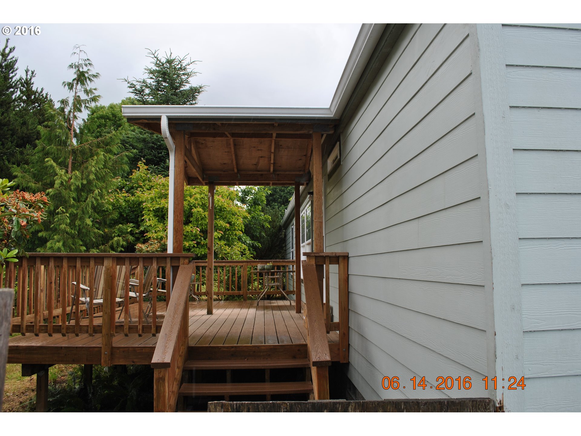 3195 Goeres Road Tillamook, OR 97141 - Photo 2 of 26 a view of backyard with deck and outdoor seating