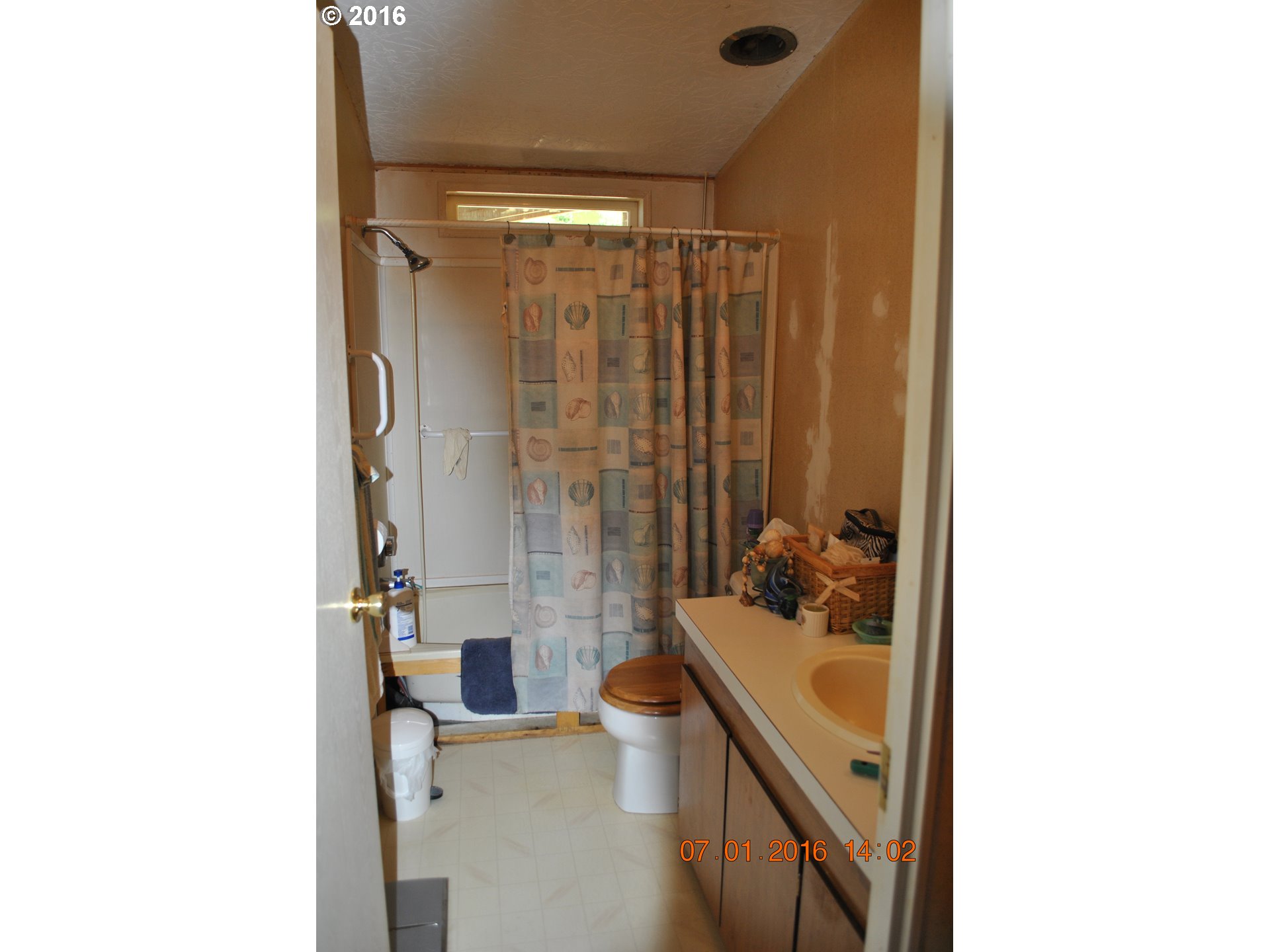 3195 Goeres Road Tillamook, OR 97141 - Photo 7 of 26 a bathroom with a sink a toilet and shower