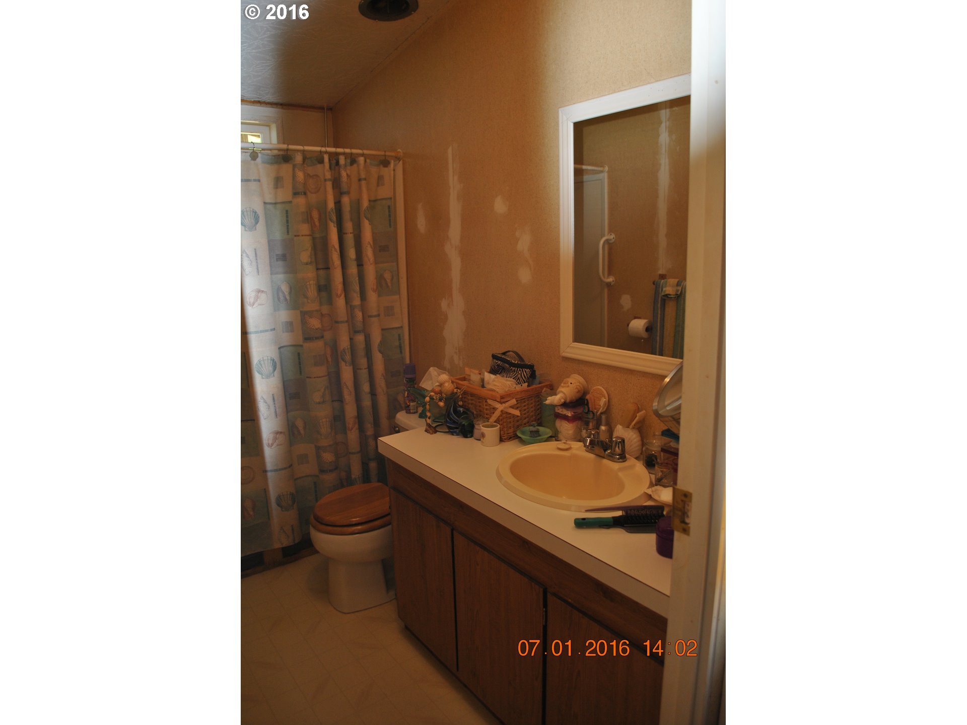 3195 Goeres Road Tillamook, OR 97141 - Photo 8 of 26 a bathroom with a sink a toilet and shower