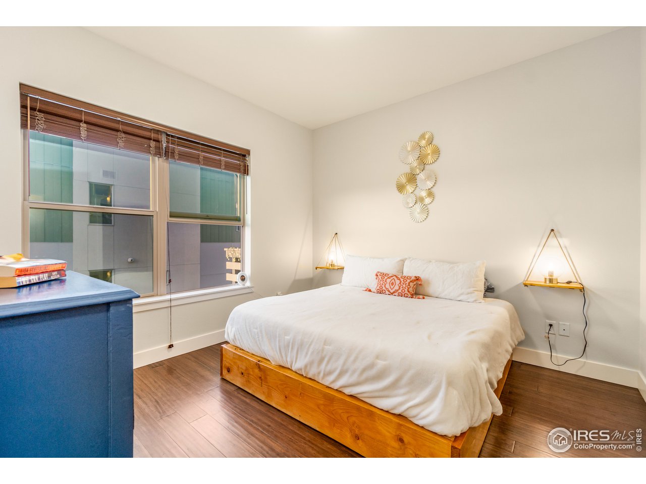 204 Maple Street, Unit 301 Fort Collins, CO 80521 - Photo 14 of 26 a bedroom with a bed and a window