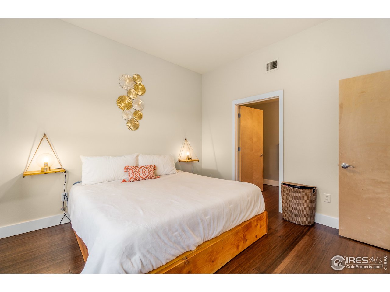 204 Maple Street, Unit 301 Fort Collins, CO 80521 - Photo 15 of 26 a bedroom with a bed and a painting on the wall