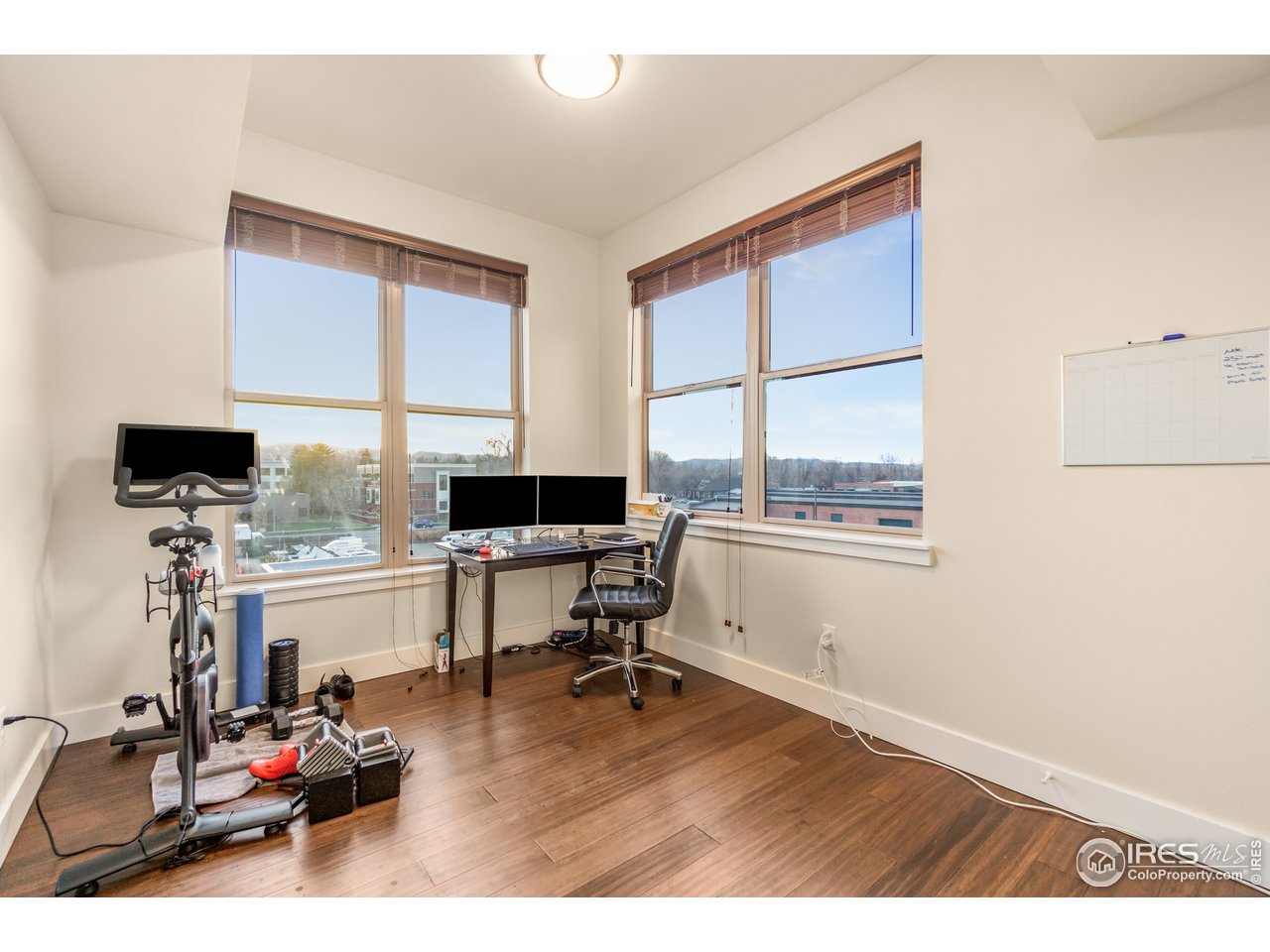 204 Maple Street, Unit 301 Fort Collins, CO 80521 - Photo 19 of 26 a living room with furniture window and wooden floor