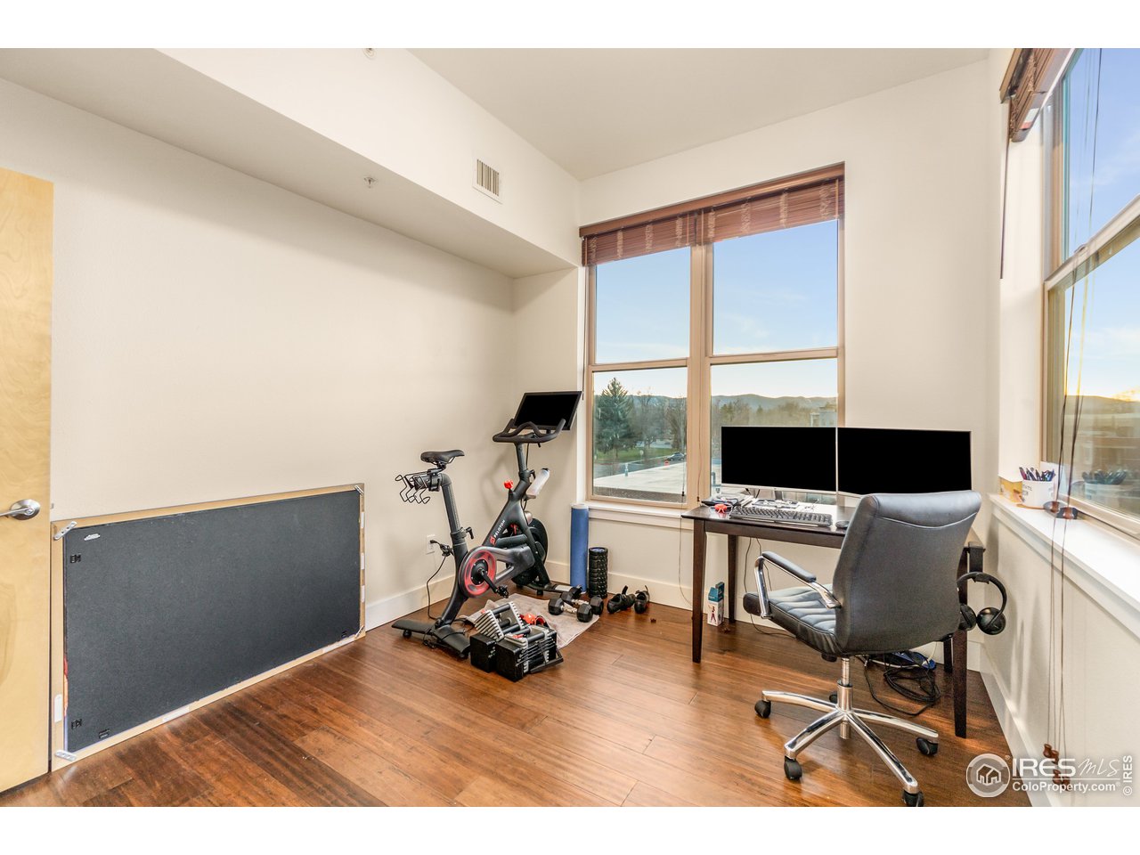 204 Maple Street, Unit 301 Fort Collins, CO 80521 - Photo 20 of 26 a view of living room with furniture and floor to ceiling window