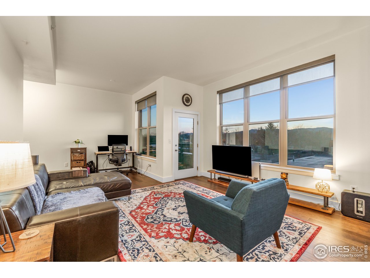 204 Maple Street, Unit 301 Fort Collins, CO 80521 - Photo 5 of 26 a living room with furniture and a flat screen tv