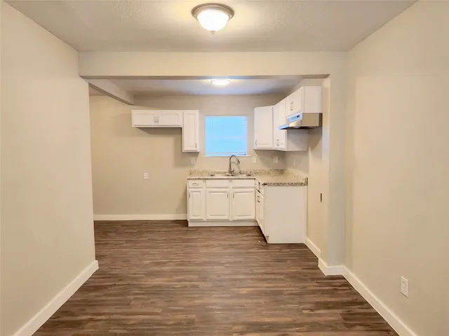 a view of kitchen with wooden floor