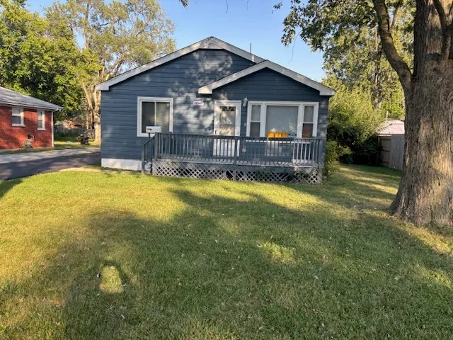 a view of a house with swimming pool and porch