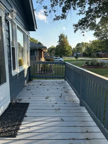 a view of deck with wooden floor and seating space