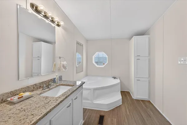 a bathroom with a sink and a mirror
