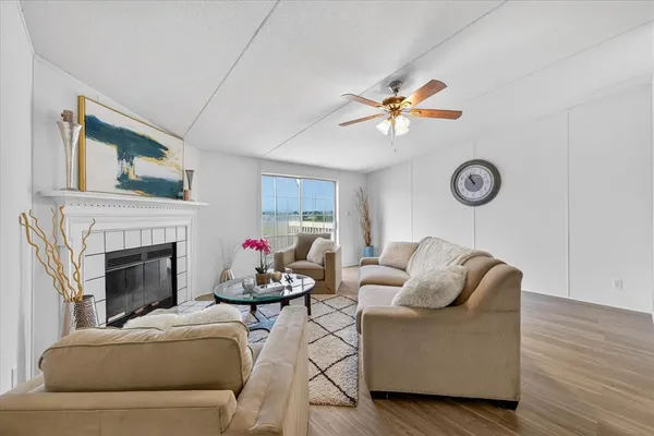 a living room with furniture and a fireplace