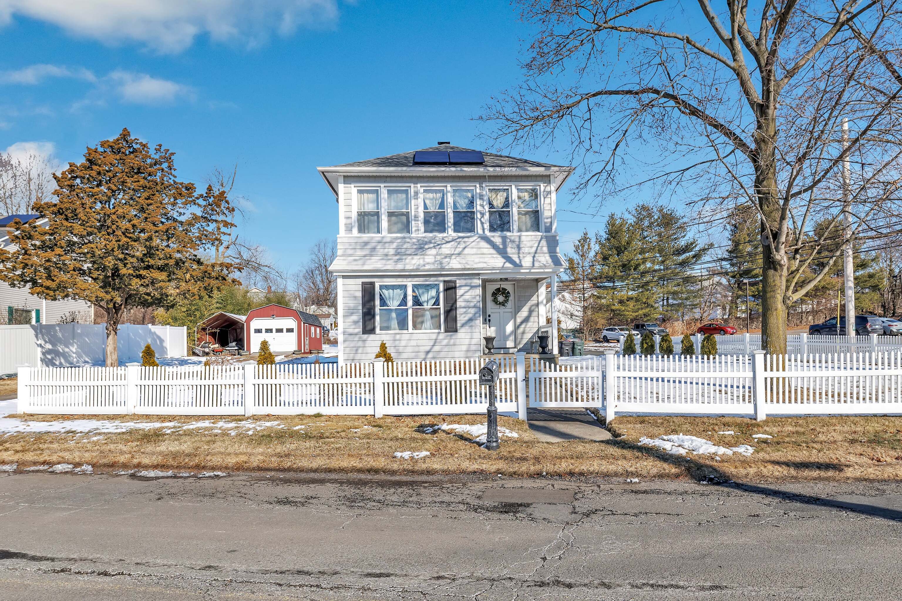 a front view of a house with a yard