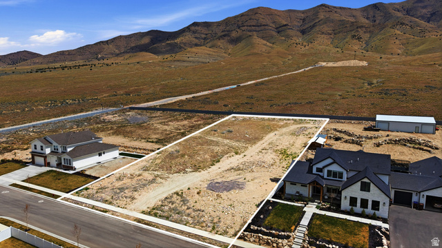 2930 Jojo Road, Unit 110 Eagle Mountain, UT 84005 - Photo 7 of 22 Aerial view of sparsely populated area with mountains and property parcel outlined