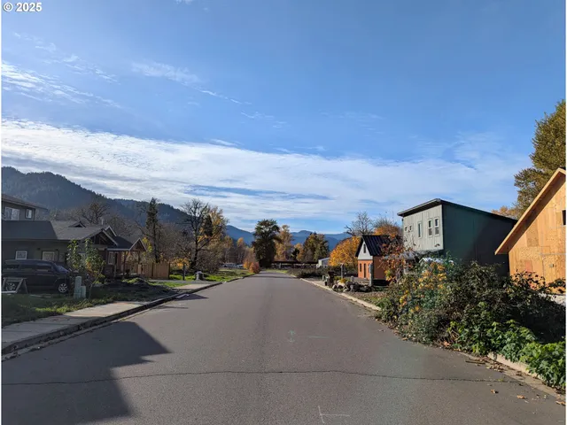 a view of a city street with a building