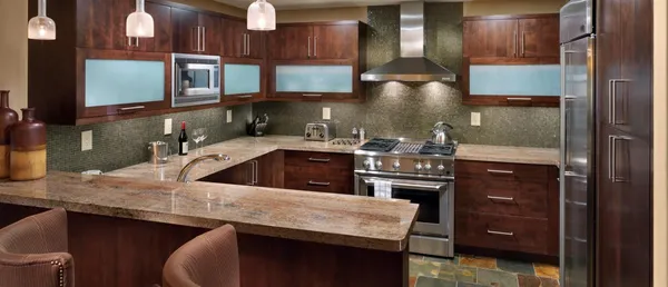 a kitchen with a sink cabinets and appliances