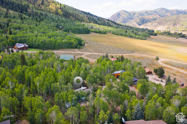 714 Spotted Fawn Way Kamas, UT 84036 - Photo 33 of 34 Aerial view of a forest and a mountainous background