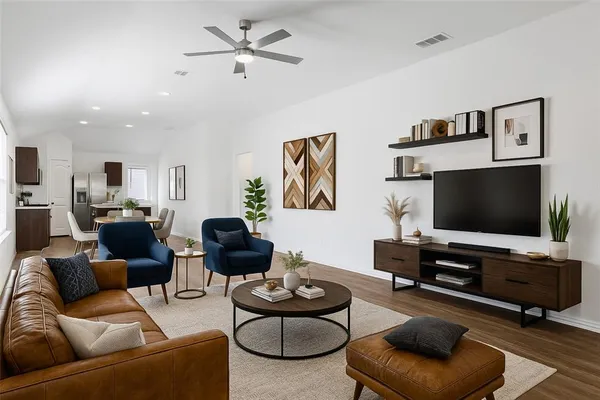 a living room with furniture and a flat screen tv