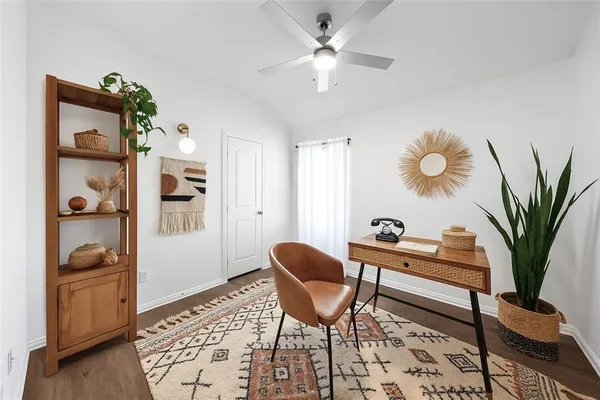 a work room with furniture and wooden floor