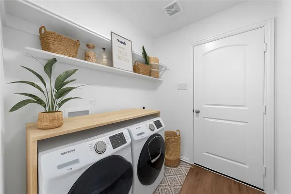 a utility room with dryer and washer