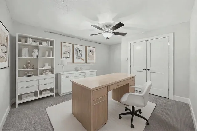 a view of a workspace with furniture