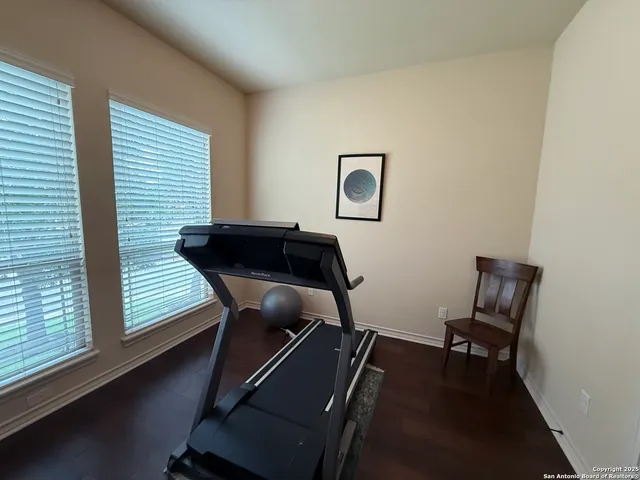 a room with chair and wooden floor