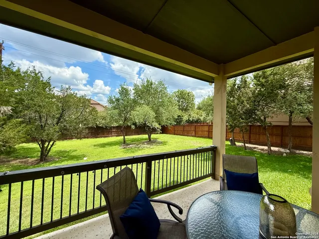 a balcony with view of outdoor space