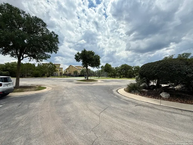 a view of street with parked cars