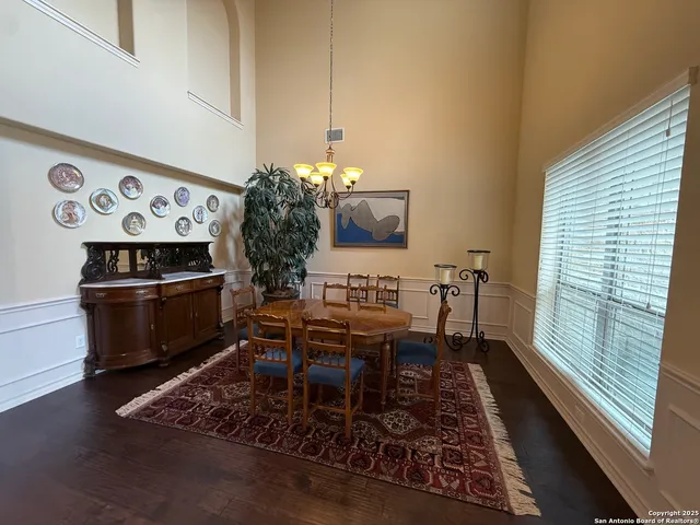 a dining room with furniture and window