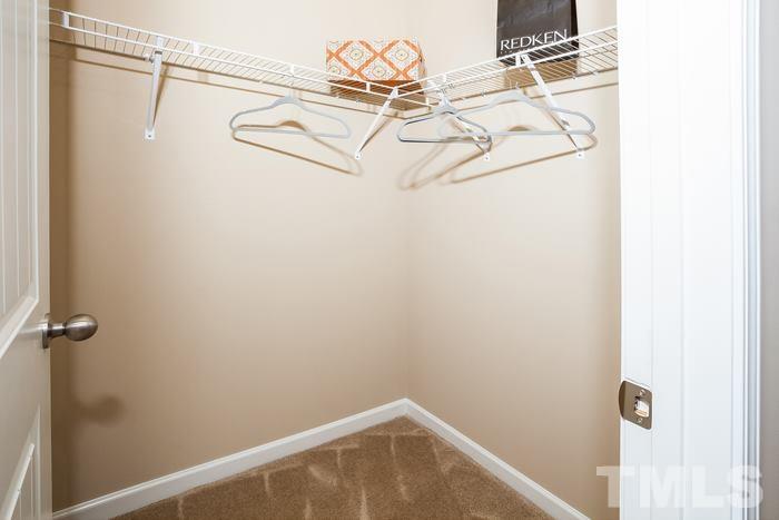 3517 Midway Island Court Raleigh, NC 27610 - Photo 7 of 9 a view of a hallway with white cabinets