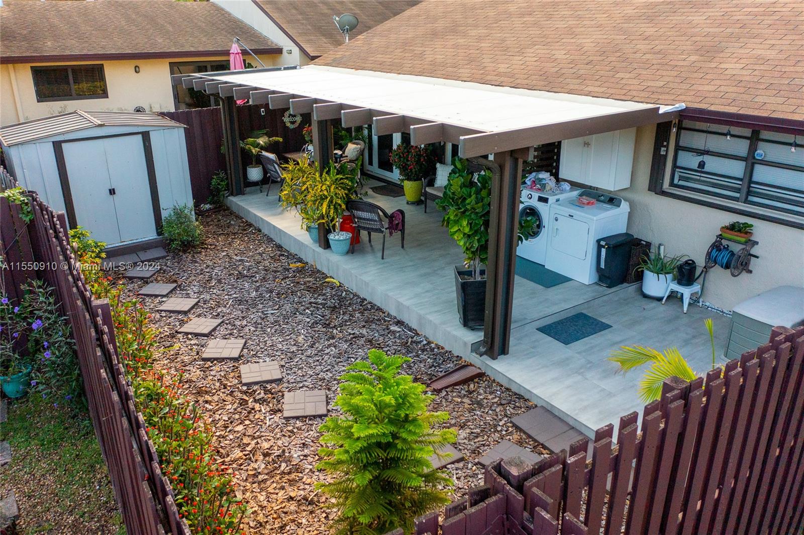 11310 Southwest 115th Terrace, Unit 11310 Miami, FL 33176 - Photo 13 of 13 an outdoor space with seating area and furniture