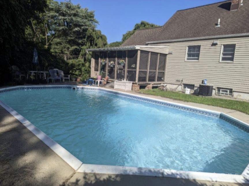 22 Wilcox Road New Brunswick, NJ 08901 - Photo 2 of 12 a view of pool with outdoor seating