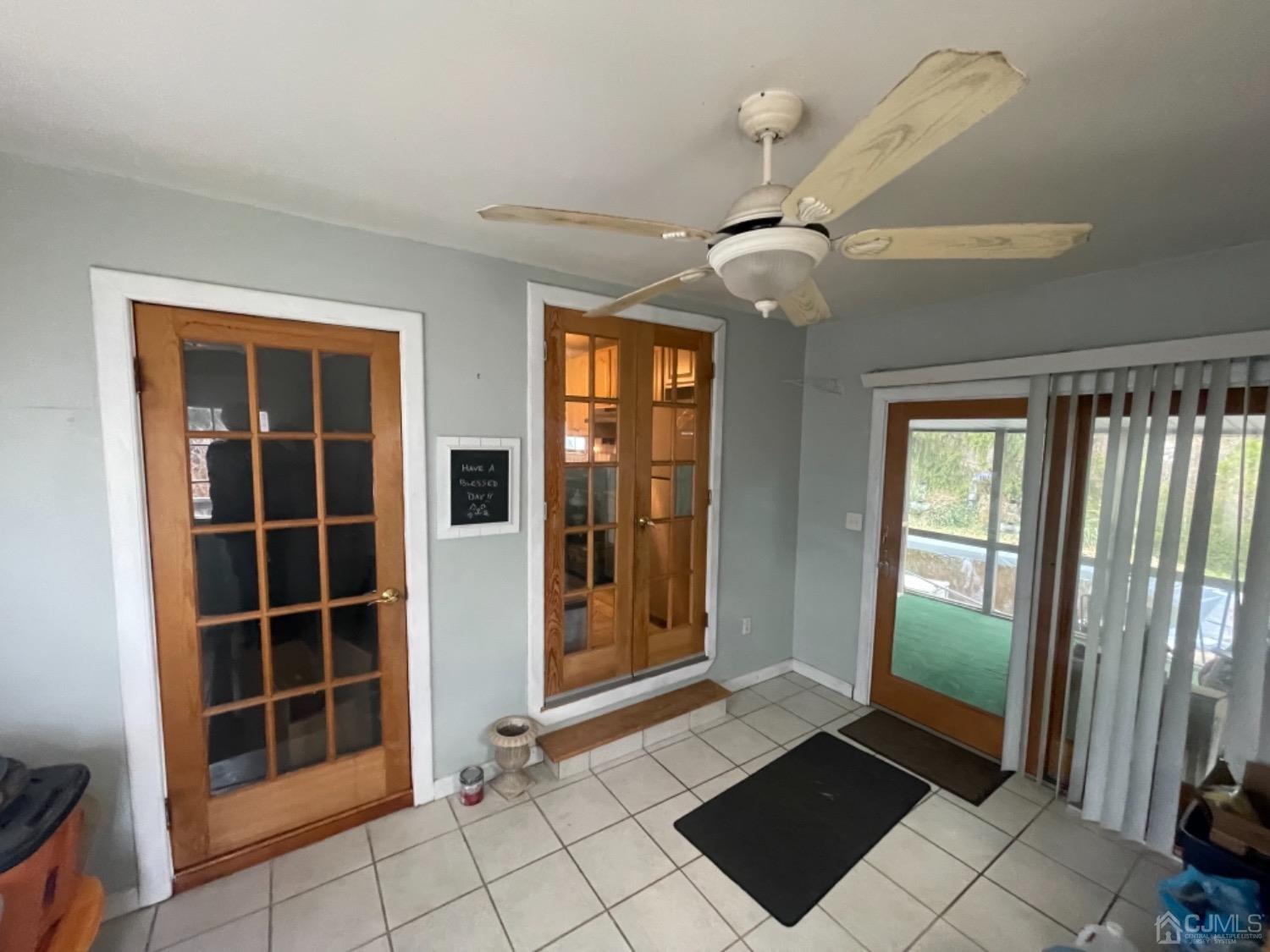 22 Wilcox Road New Brunswick, NJ 08901 - Photo 4 of 12 a view of an entryway with wooden floor and door