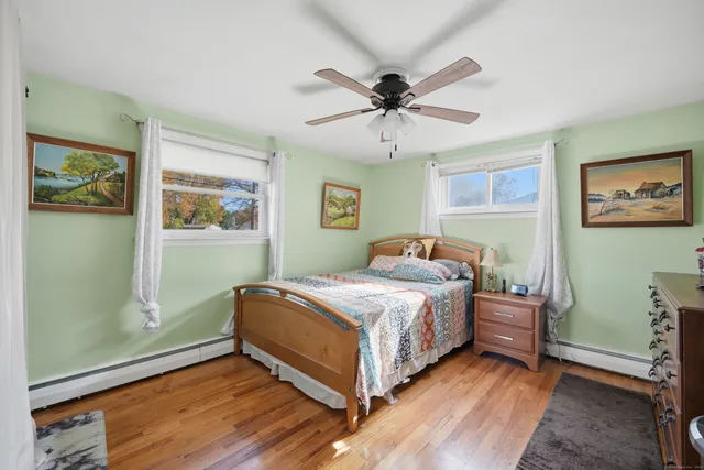 a bedroom with a bed and window