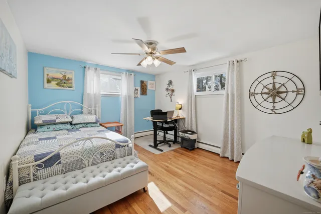 a bedroom with a bed and a table in it