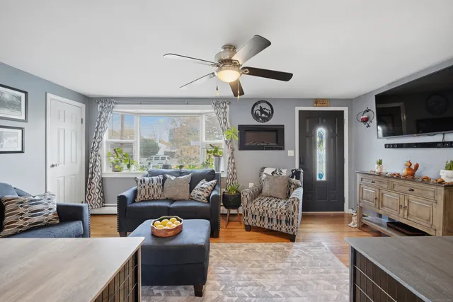 a living room with furniture and a flat screen tv