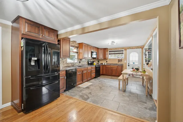 a kitchen with a refrigerator and a sink