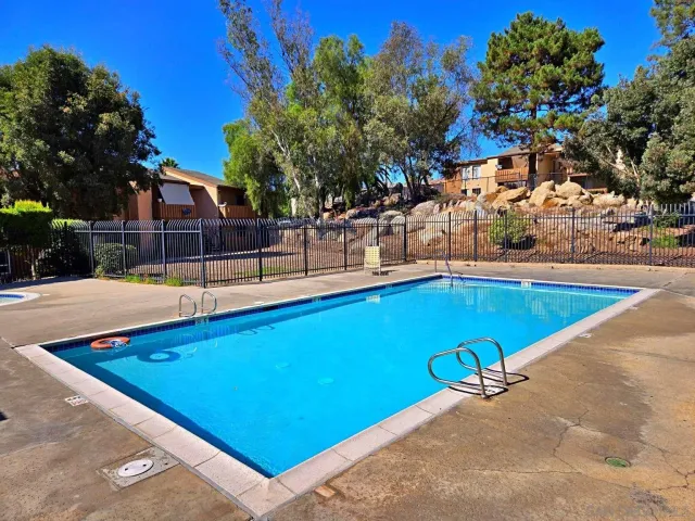 a view of a swimming pool with a bench