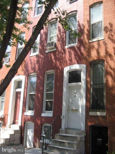 a front view of a multi story residential apartment building