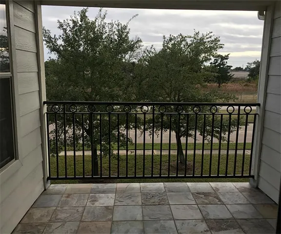 a view of a balcony with an outdoor space