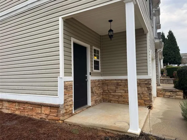 a view of a house with window and brick walls
