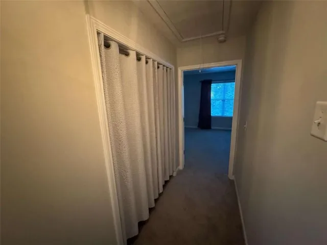 a view of house with backyard and trees