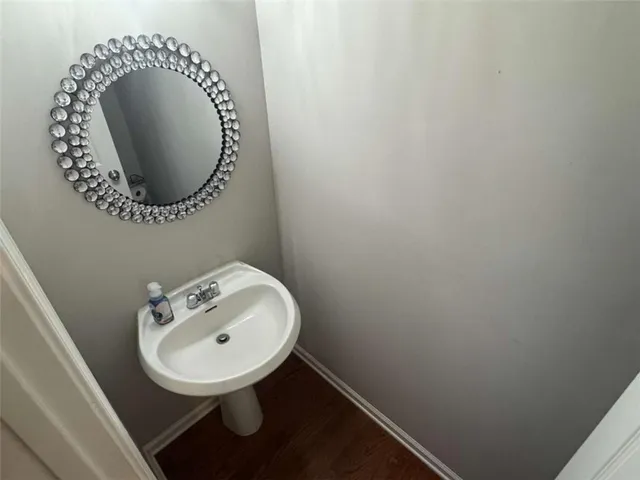 a bathroom with a sink and mirror