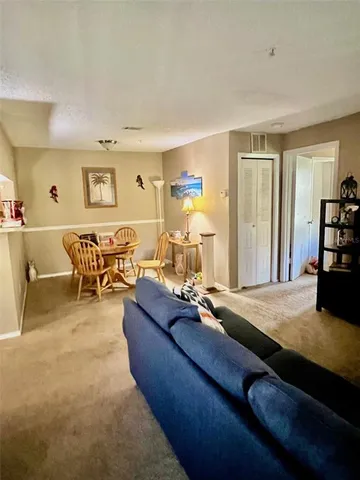 a living room with furniture window and a couch