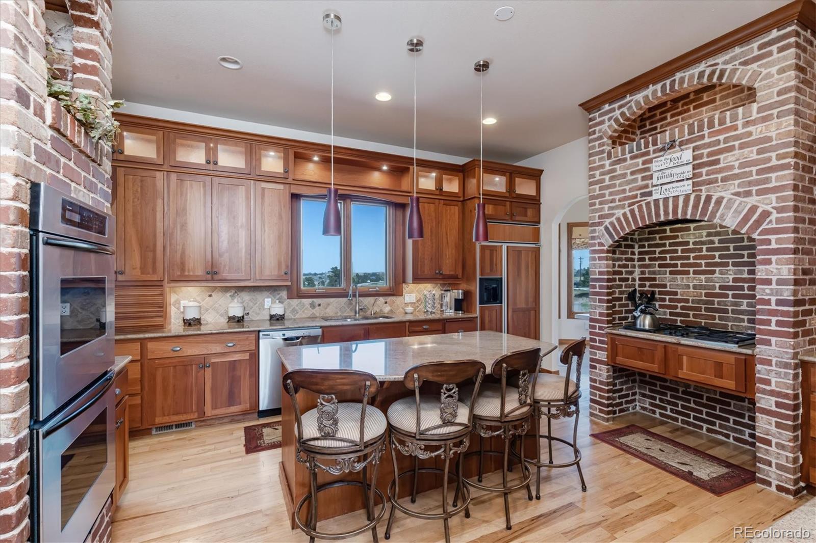 12080 Summit Ridge Road Parker, CO 80138 - Photo 14 of 39 a kitchen with a sink and cabinets