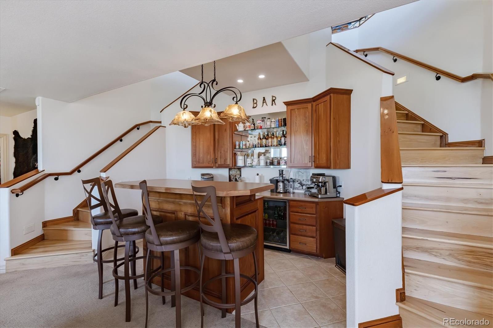 12080 Summit Ridge Road Parker, CO 80138 - Photo 25 of 39 a dining room with furniture and entryway