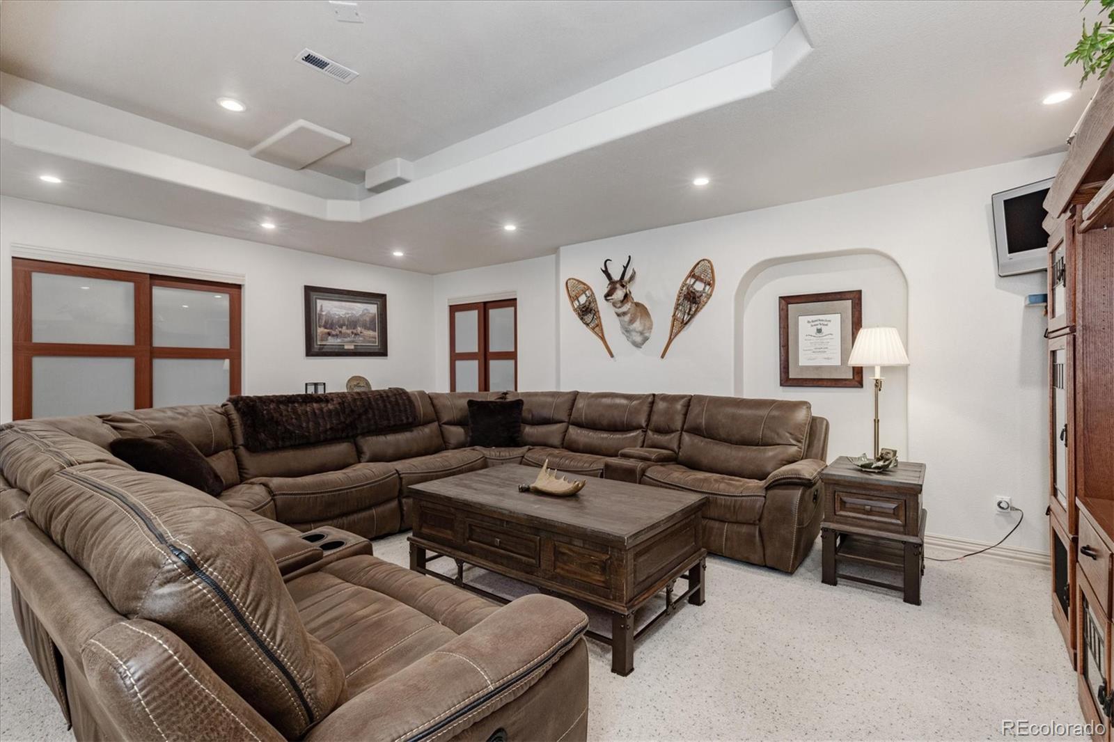 12080 Summit Ridge Road Parker, CO 80138 - Photo 29 of 39 a living room with furniture ceiling fan and a window